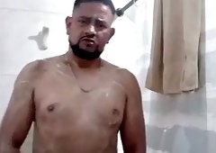 The fat boy takes a shower on the orders of his master