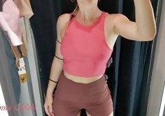 A girl with a perfect figure and small breasts tries on different clothes