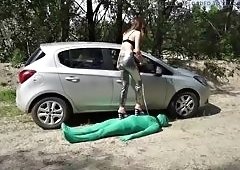 Femdom Chick Punishes Suited Man in BDSM Outdoors